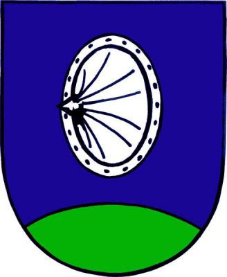 V modrém štítě nad zeleným návrším stříbrný kruhový štít s puklicí a hrotem. Znak Chanovice