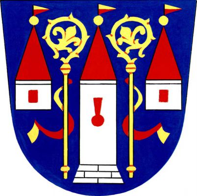 V modrém štítě stříbrná věž na kvádrovaném soklu s červenou klíčovou střílnou provázená na okrajích dvěma stříbrnými věžemi s jedním červeným oknem, všechny tři věže mají červené jehlanové střechy zakončené zlatou makovicí a zlatočerveným doleva vlajícím praporkem - plamenem. Mezi věžemi dvě zlaté odvrácené berly s červeno-zlatými sudarii. Znak Damníkov