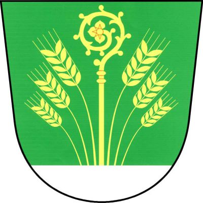 V zeleném štítě ze stříbrné paty vyrůstající berla provázená šesti (3,3) odkloněnými ustupujícími obilnými klasy, vše zlaté. Znak Dolany