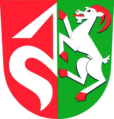 Červeno-zeleně polcený štít, vpravo vyniká od středu půl stříbrné zavinuté střely, vlevo stříbrný, červeně ozbrojený kozel ve skoku. Znak Dolní Újezd