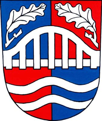 Modro-červeně čtvrcený štít, uprostřed do krajů štítu most s obloukovým zábradlím provázeným nahoře dvěma přivrácenými dubovými listy, dole dvě vlnitá břevna, vše stříbrné. Znak Doudleby nad Orlicí