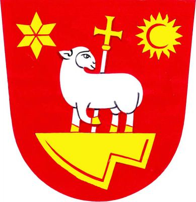 V červeném štítě na horním okraji položené zlaté radlice ohlížející se vykračující stříbrná ovečka se zlatou zbrojí, za ní zlatý procesní kříž na stříbrné holi, provázená nahoře vpravo hvězdou a vlevo sluncem, obojí zlaté. Znak Dražovice
