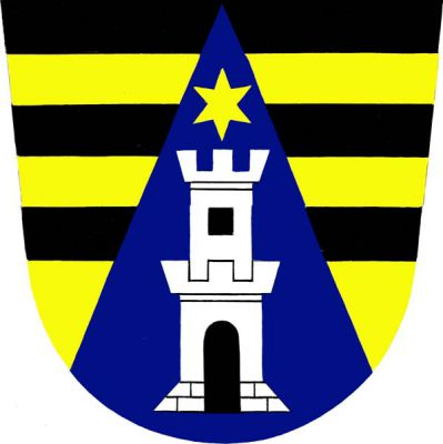 V černo-zlatě pětkrát děleném štítě modrý hrot, v něm stříbrná patrová věž s dvojitým cimbuřím, černou branou a oknem, převýšená zlatou hvězdou. Znak Drnovice