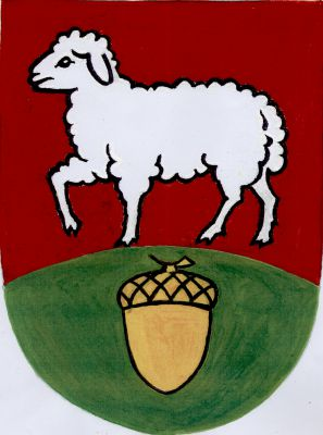 V červeném štítě nad zvýšeným zeleným návrším se svěšeným zlatým žaludem kráčející stříbrný beránek. Znak Dubany