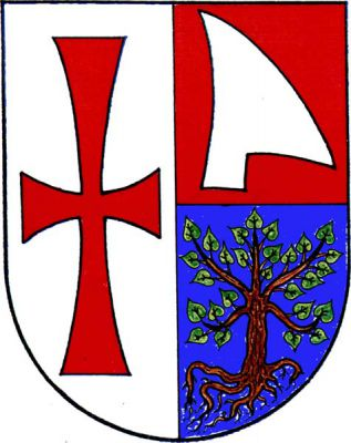 Polcený štít, v pravém stříbrném poli červený tlapatý kříž, levá polovina červeno-modře dělena, nahoře vztyčená stříbrná radlice ostřím doleva, dole vykořeněná lípa přirozené barvy. Znak Dukovany