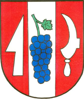 V červeném štítě stříbrný kůl s modrým vinným hroznem a zeleným listem, provázený vpravo vztyčenou stříbrnou radlicí, vlevo stříbrným vinařským nožem. Znak Heršpice