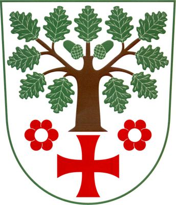 Ve stříbrném štítě uťatý dub přirozené barvy nad červeným tlapatým křížem, vše provázeno dvěma červenými šestilistými květy se stříbrnými středy. Znak Horní Dubňany