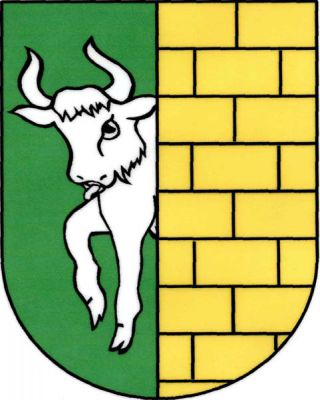 V zeleno-zlatě polceném štítě vpravo vyrážející stříbrný býk, levé pole kvádrované. Znak Hředle