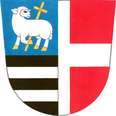 Polcený štít, pravé pole modro-černě děleno, nahoře stříbrný ohlížející se beránek se zlatou zbrojí, držící zlatý kříž, dole dvě stříbrná břevna. V levém červeném poli půl stříbrného heroldského kříže. Znak Jankovice