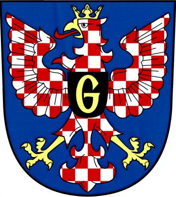 V modrém štítě moravská orlice nesoucí na hrudi černý štítek se zlatým majuskulním písmenem G. Znak Jevíčko