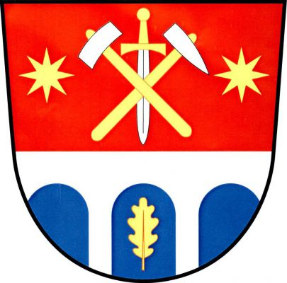 Červeno - modře stříbrným mostem se třemi oblouky dělený štít. Nahoře kosmý mlátek šikmo podložený želízkem a postaveným mečem, vše stříbrné se zlatými topůrky a jílcem, provázené dvěma zlatými osmihrotými hvězdami, dole v prostředním oblouku vztyčený zlatý dubový list. Znak Jezdovice