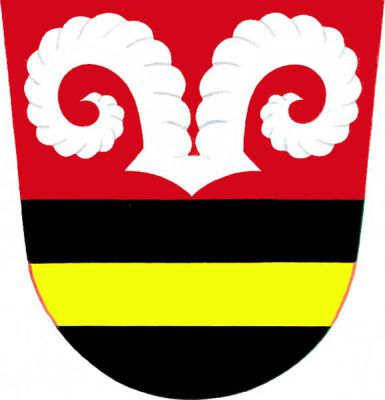 V červeno-černě děleném štítě nahoře stříbrné beraní rohy, dole zlaté břevno. Znak Kamenný Újezd