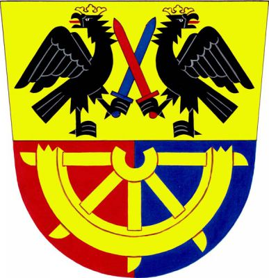 Dělený štít, nahoře ve zlatém poli dvě proti sobě stojící černé odvrácené korunované orlice s červenými jazyky, držící v pařátech dva zkřížené meče, pravá modrý, levá červený. Dolní pole červeno-modře polceno, v něm dolní polovina zlatého kola sv. Kateřiny. Znak Kašava