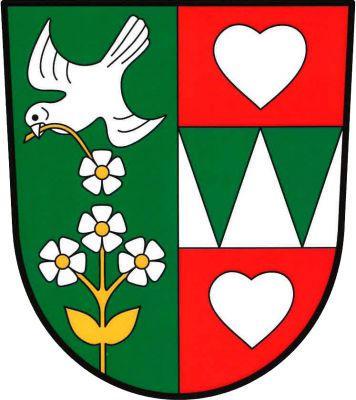 V zeleno-červeně polceném štítě vpravo šikmo dolů letící stříbrný pták, držící v zobáku na zlatém stonku stříbrný pětilistý květ se zlatým středem, nad třemi stříbrnými pětilistými květy se zlatými středy na jednom vyrůstajícím stonku se dvěma listy, vše zlaté, vlevo stříbrné břevno se dvěma zelenými klíny provázené nahoře a dole stříbrným srdcem. Znak Kolešov