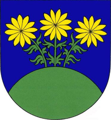 V modrém štítě vyrůstají ze zeleného návrší na zelených stoncích tři zlaté květy, každý o dvanácti okvětních lístcích (hlaváček jarní). Znak Korozluky