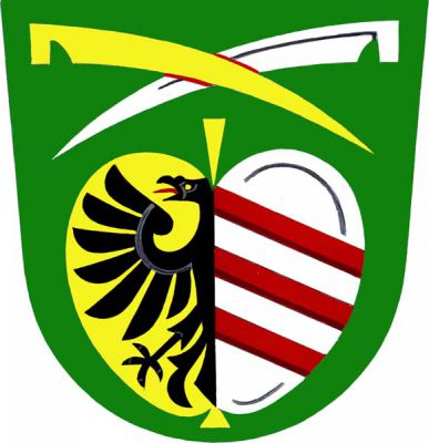 V zeleném štítě pod dvěma zkříženými kosami pravou zlatou nad levou stříbrnou, zlato-stříbrně polcené jablko, vpravo půl černé orlice a vlevo tři kosmá červená břevna. Znak Kožušice