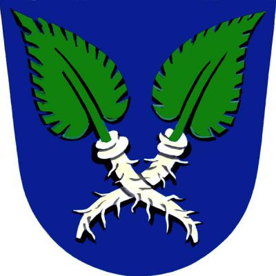 V modrém štítě zkřížené stříbrné kořeny křenu, každý s jedním zeleným listem. Znak Křenovice