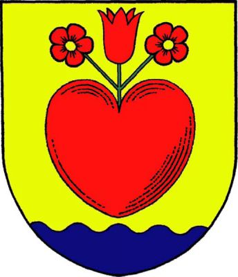 Ve zlatém štítě nad modrou vlnitou patou červené srdce kvetoucí třemi červenými květy na zeleném rozvětveném stonku, postranní pětilisté se zlatými středy, prostřední zvonkovitý vztyčený. Znak Křetín