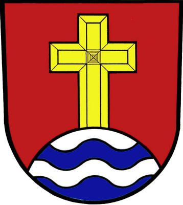 V červeném štítě zlatý latinský kříž vyrůstající ze třikrát stříbrno-modře vlnitě děleného návrší. Znak Kružberk