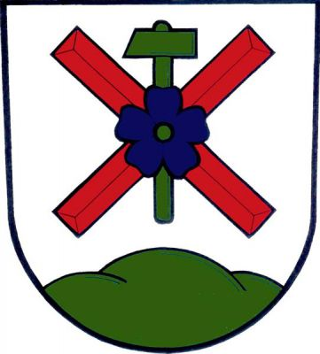 Ve stříbrném štítě nad zeleným trojvrším volný červený ondřejský kříž přeložený vztyčeným zeleným kladivem a modrým květem lnu. Znak Kunčice pod Ondřejníkem