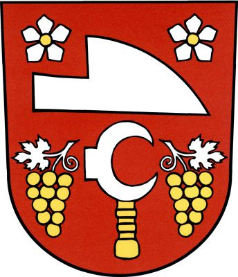 V červeném štítě doleva položená stříbrná radlice, provázená nahoře dvěma stříbrnými pětilistými květy se zlatými středy, pod ní doleva obrácený stříbrný vinařský nůž - kosíř se zlatou rukojetí, provázený dvěma zlatými vinnými hrozny, každý na stříbrném stonku s odvráceným listem. Znak Ladná
