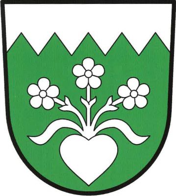 V zeleném štítě pod pilovitou hlavou srdce kvetoucí třemi pětilistými květy na stoncích mezi dvěma listy, vše stříbrné. Znak Lesní Jakubov