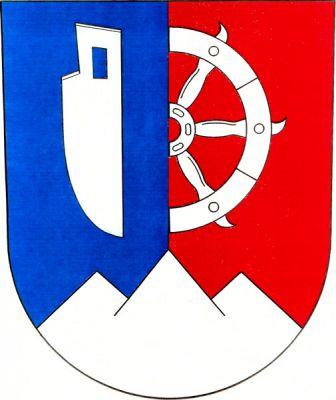 V modro-červeně polceném štítě nad skalnatým trojvrším vpravo radlice, vlevo vyniká od středu půl kola svaté Kateřiny, vše stříbrné. Znak Lidečko