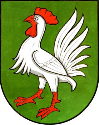 V zeleném štítě stříbrný kohout s červenou zbrojí. Znak Líšná