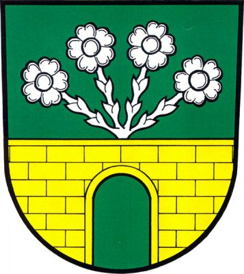 V zeleném štítě zlatá kvádrovaná zeď s prázdnou branou, ze zdi vějířovitě vyrůstají čtyři stříbrné luční květy. Znak Norberčany
