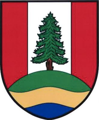 V červeném štítě se stříbrným kůlem vyrůstá ze zeleno-zlato-modře vlnitě děleného návrší modřín přirozené barvy. Znak Nové Heřminovy