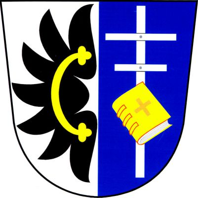 Ve stříbrno-modře polceném štítě vpravo doleva černé orlí křídlo s celým zlatým, jetelovitě zakončeným perizoniem, vlevo stříbrný dvojramenný kříž s delším horním ramenem, dole kosmo přeložený zlatou knihou s červeným řeckým křížem desce a se stříbrnou ořízkou. Znak Pavlov