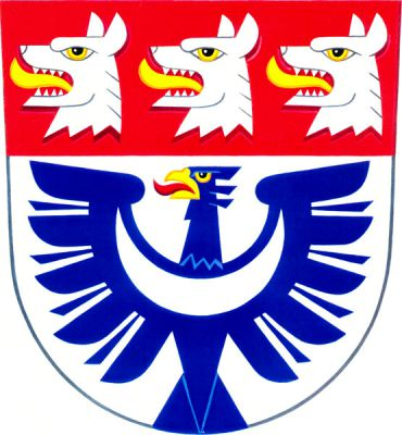 Ve stříbrném štítě modrá vyrůstající orlice se zlatou zbrojí a stříbrným perisoniem, v stříbrné hlavě štítu tři stříbrné vlčí hlavy se zlatými jazyky. Znak Pavlovice u Přerova