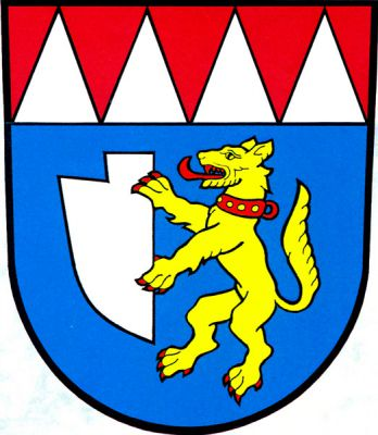 V modrém štítě pod červenou hlavou se čtyřmi stříbrnými kužely zlatý pes ve skoku s červenou zbrojí a obojkem, držící stříbrnou radlici. Znak Petrovice
