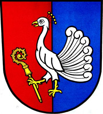 V červeno-modře polceném štítě stříbrný páv se zlatou zbrojí držící v pravém pařátu zlatou berlu. Znak Petřvald