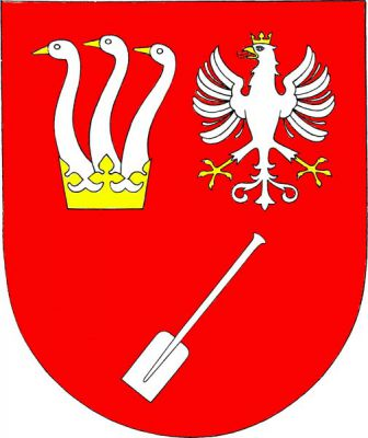 V červeném štítě nahoře vedle sebe ze zlaté koruny vyrůstající tři stříbrné husí krky se zlatými zobáky a stříbrná korunovaná orlice se zlatou zbrojí, pod nimi šikmo položené stříbrné pádlo. Znak Příchovice