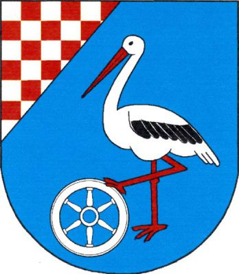 V modrém štítě se stříbrno-červeně šachovaným koutem čáp přirozených barev přidržující stříbrné vozové kolo. Znak Prusy-Boškůvky