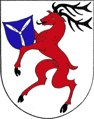 Ve stříbrném štítě červený jelen ve skoku s černou zbrojí, držící modrý štítek se stříbrnou leteckou třílistou vrtulí. Znak Sedlec