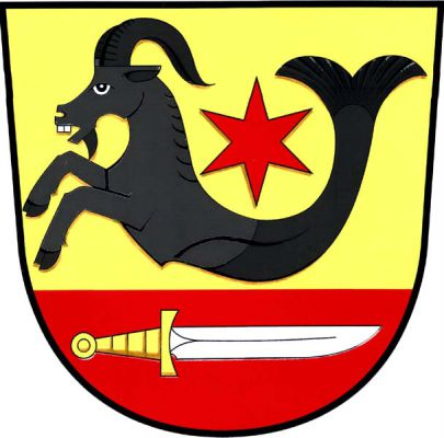 Ve zlatém štítě nad červenou patou s doleva položeným stříbrným nožem se zlatou rukojetí černý kozoroh s rybím ocasem a červenou hvězdou nad hřbetem. Znak Semanín
