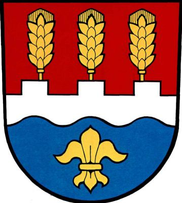 V červeno-modře stříbrným, nahoře cimbuřovým a dole vlnitým břevnem děleném štítě ze stínek vyrůstající tři obilné klasy, dole lilie, vše zlaté. Znak Semechnice