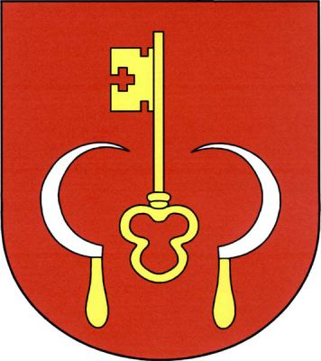 V červeném štítě vztyčený zlatý klíč dole provázený dvěma přivrácenými stříbrnými srpy se zlatými rukojeťmi. Znak Senožaty