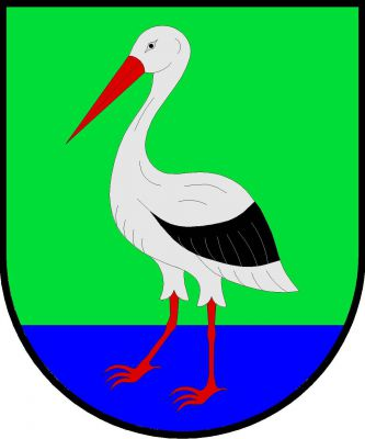 V zeleném štítě s modrou patou stříbrný čáp s černým křídlem a červenou zbrojí. Znak Šestajovice