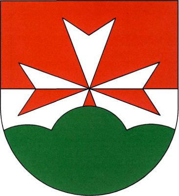 V červeno-stříbrně děleném štítě vyrůstá ze zeleného trojvrší osmihrotý kříž opačných barev. Znak Staňkovice