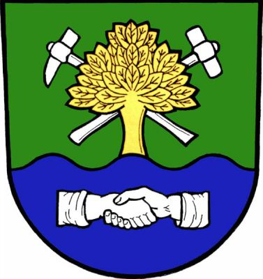 V zeleno-modře sníženě vlnitě děleném štítě nahoře vyrůstající zlatý listnatý strom podložený zkříženými stříbrnými hornickými kladívky, dole dvě stříbrné stisknuté ruce s rukávy. Znak Stará Ves