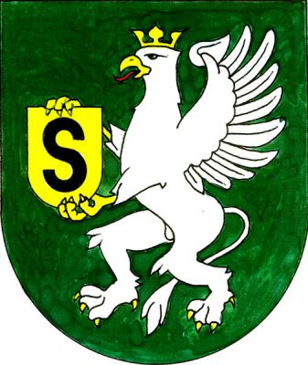 V zeleném štítě stříbrný korunovaný gryf se zlatou zbrojí držící zlatý štítek s černým majuskulním \S\"." Znak Stonava
