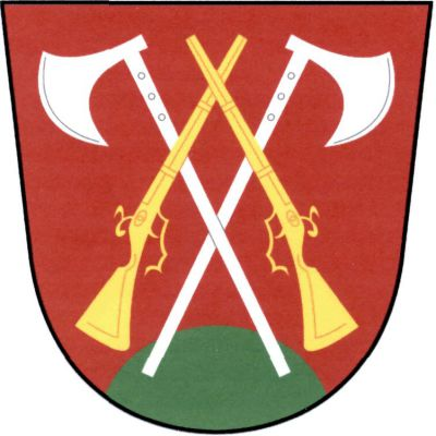 V červeném štítě se zeleným návrším zkřížené stříbrné chodské čakany přeložené zlatými přivrácenými ručnicemi se zkříženými hlavněmi. Znak Stráž