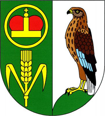 V zeleno-stříbrně polceném štítě vpravo nad zlatým obilným klasem se dvěma listy ve zlatém kruhu knížecí čepice ozdobená jablkem s křížkem, vlevo na zeleném návrší moták pochop přirozené barvy. Znak Třebětice