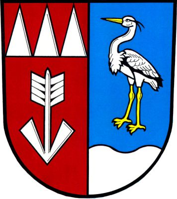 V červeno-modře polceném štítě vpravo pod třemi kužely dolů obrácená střela, vše stříbrné, vlevo nad stříbrnou vlnitou patou stříbrná volavka se zlatou zbrojí. Znak Třemešná