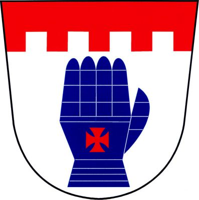 Ve stříbrném štítě pod červenou cimbuřovou hlavou modrá zbrojná rukavice palcem doleva s červeným tlapatým křížem. Znak Velenice