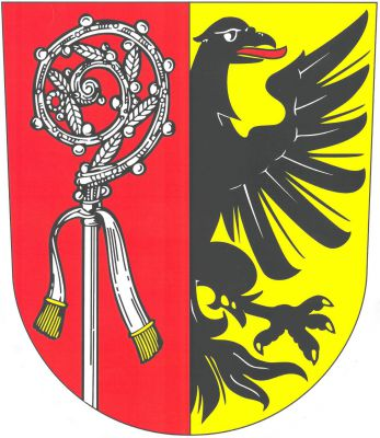 V červeno - zlatě polceném štítě vpravo vyrůstající stříbrná berla se stříbrným sudariem se zlatým třepením, vlevo vynikající půl černého orla s červeným jazykem. Znak Velké Němčice