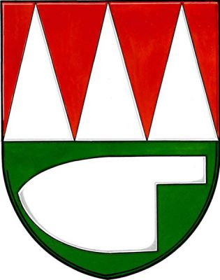 V červeno-zeleně děleném štítě nahoře tři kužely, dole doprava otočená radlice, vše stříbrné. Znak Velký Týnec